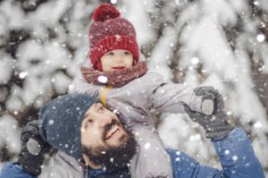 Man and child in snow